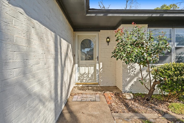 property entrance with brick siding