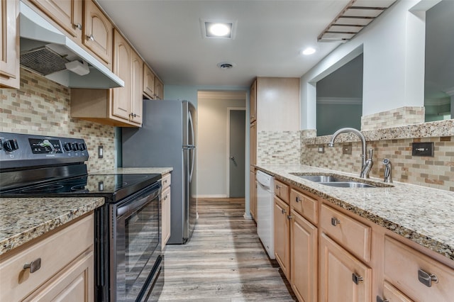 kitchen with range with electric stovetop, light brown cabinets, a sink, dishwasher, and under cabinet range hood