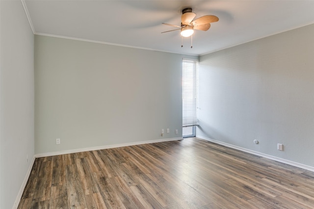 unfurnished room featuring ceiling fan, ornamental molding, wood finished floors, and baseboards