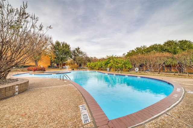 pool with a patio area