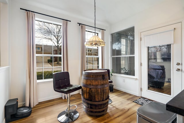 sitting room featuring baseboards and wood finished floors