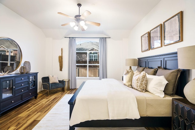 bedroom with a ceiling fan and wood finished floors