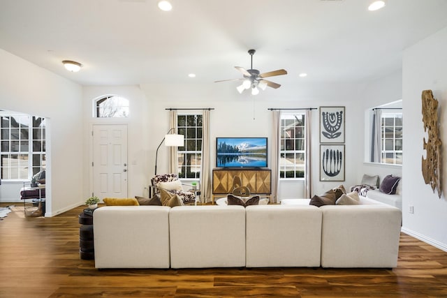 living area with baseboards, ceiling fan, dark wood finished floors, and recessed lighting