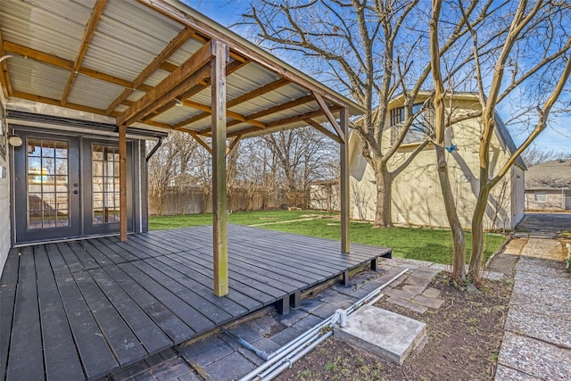 wooden deck with a yard, french doors, and fence