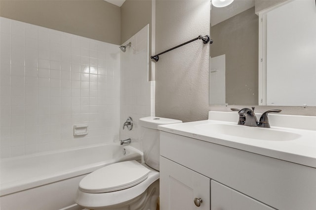 full bath with a textured wall, bathing tub / shower combination, vanity, and toilet