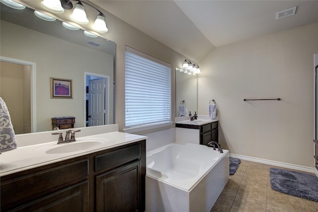 full bathroom with visible vents, a sink, and tile patterned floors