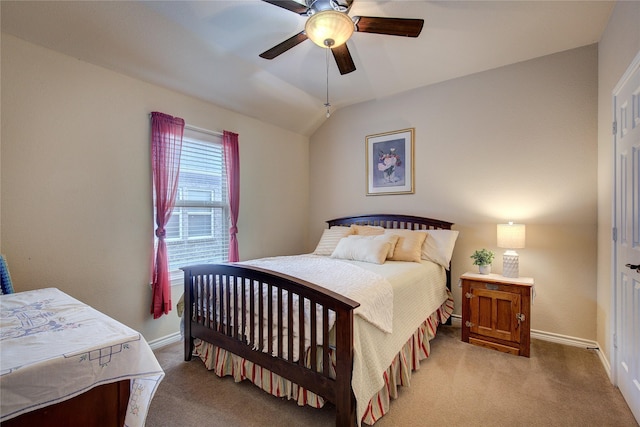 carpeted bedroom featuring vaulted ceiling, baseboards, and ceiling fan