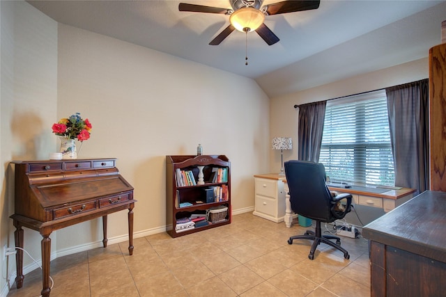 office area featuring lofted ceiling, light tile patterned floors, ceiling fan, and baseboards