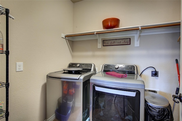 laundry area featuring washing machine and dryer and laundry area