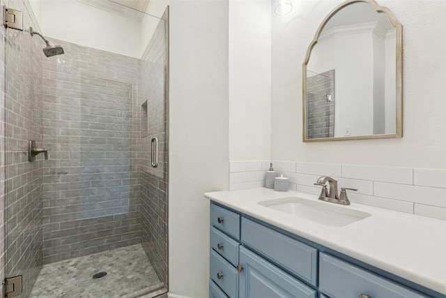 bathroom with a shower stall and vanity