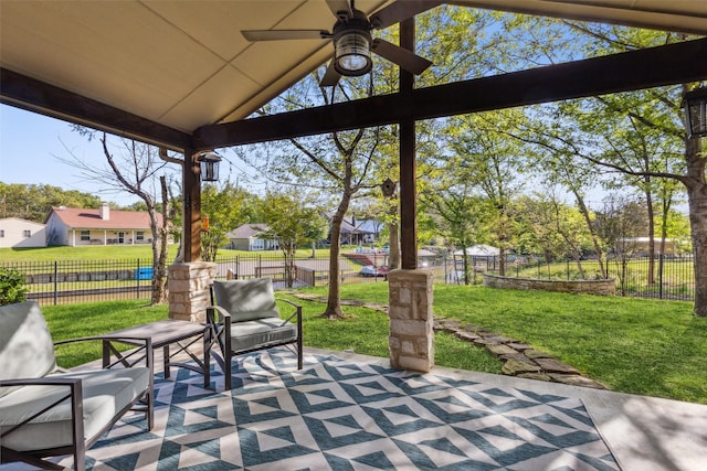 view of patio / terrace featuring ceiling fan, a residential view, and a fenced backyard