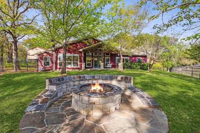 view of patio / terrace with fence private yard and an outdoor fire pit