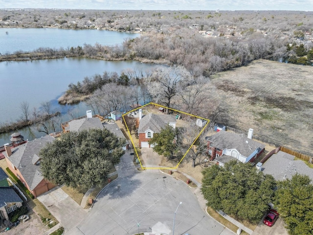 bird's eye view featuring a water view and a residential view