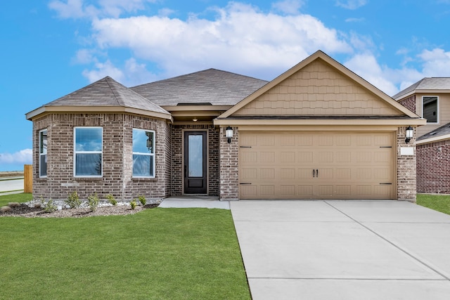 view of front of property featuring a garage, brick siding, driveway, roof with shingles, and a front yard