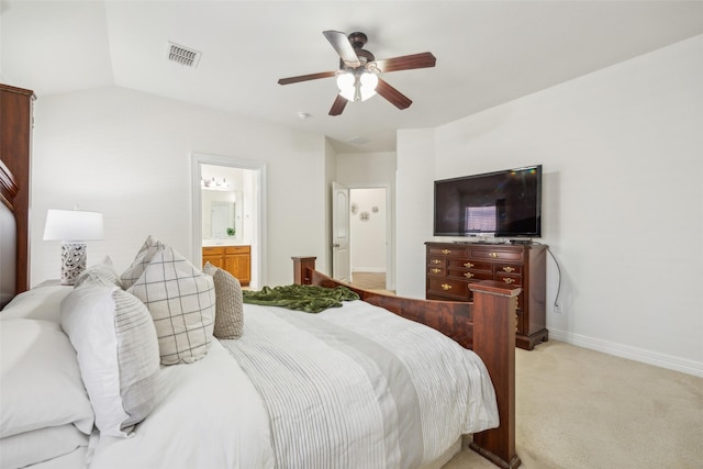 bedroom with light colored carpet, visible vents, ensuite bathroom, ceiling fan, and baseboards