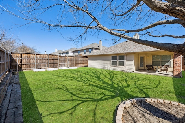 view of yard featuring a fenced backyard and a patio