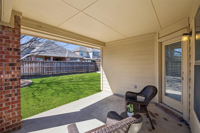 view of patio / terrace featuring fence