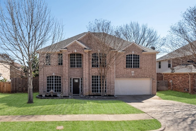 view of front facade featuring an attached garage, a front yard, fence, and brick siding