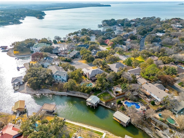 drone / aerial view with a residential view and a water view