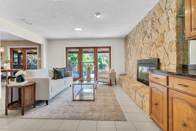 living area featuring visible vents, a wealth of natural light, and french doors