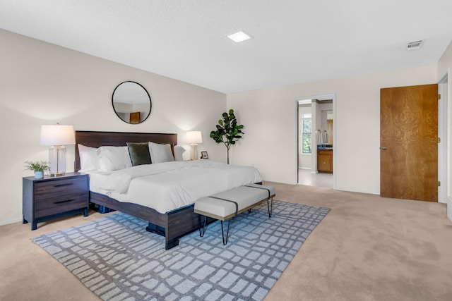 carpeted bedroom featuring visible vents