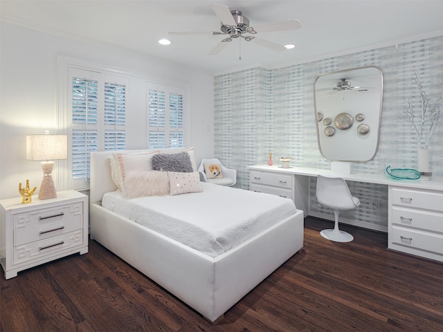 bedroom with dark wood-type flooring, a ceiling fan, built in desk, and recessed lighting