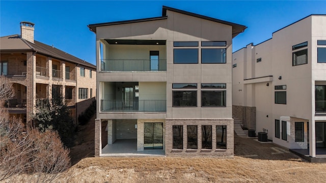 rear view of property with stucco siding