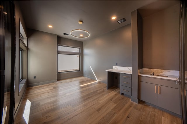 interior space featuring recessed lighting, visible vents, and wood finished floors