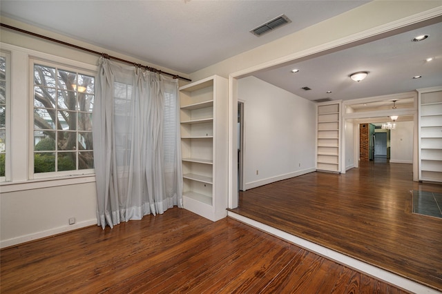 4705 El Campo Ave, Fort Worth, TX 76107 - spare room featuring an inviting chandelier, wood finished floors, visible vents, and baseboards