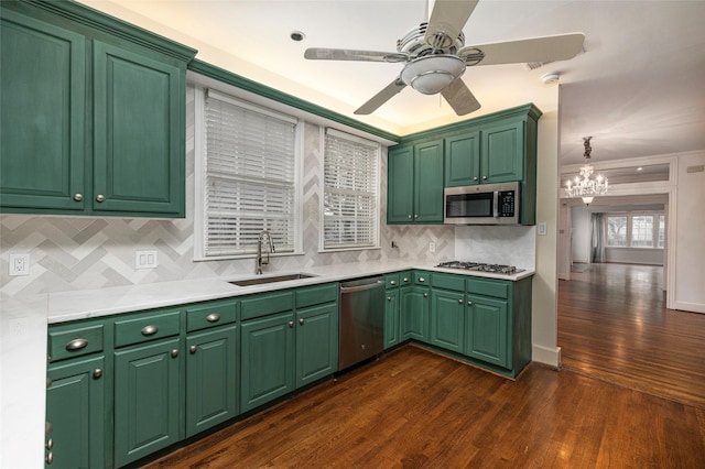 4705 El Campo Ave, Fort Worth, TX 76107 - kitchen featuring stainless steel appliances, dark wood-style flooring, light countertops, and a sink