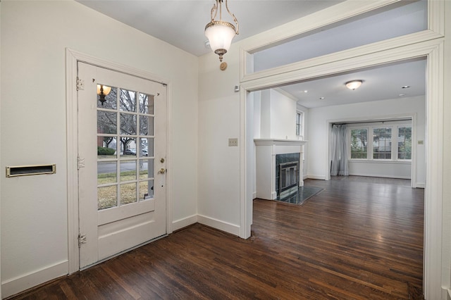 4705 El Campo Ave, Fort Worth, TX 76107 - entryway with a fireplace, baseboards, and dark wood-style flooring