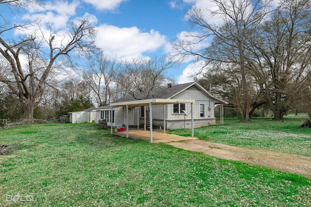 rear view of property with a yard