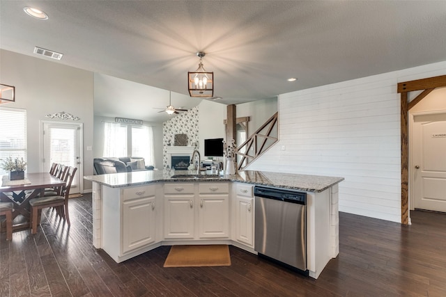 kitchen featuring visible vents, dark wood-type flooring, open floor plan, a sink, and dishwasher