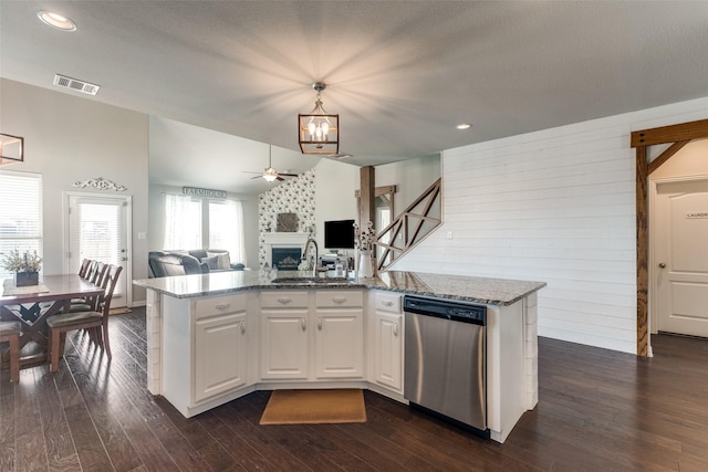 5705 Bender Ridge Dr, Mckinney, TX 75071 - kitchen featuring dishwasher, a sink, a ceiling fan, open floor plan, and dark wood-type flooring