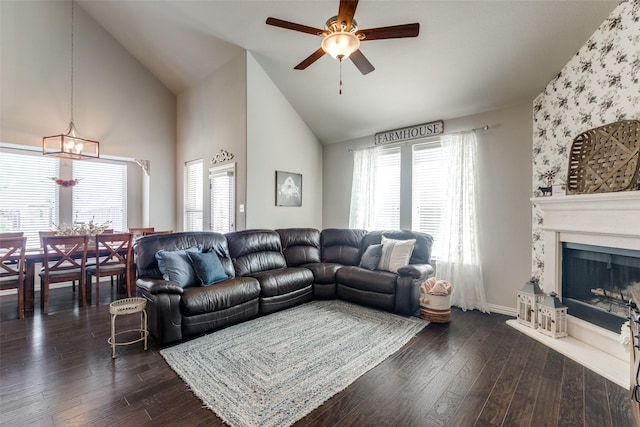 5705 Bender Ridge Dr, Mckinney, TX 75071 - living room with ceiling fan, plenty of natural light, high vaulted ceiling, a fireplace with raised hearth, and dark wood-style floors