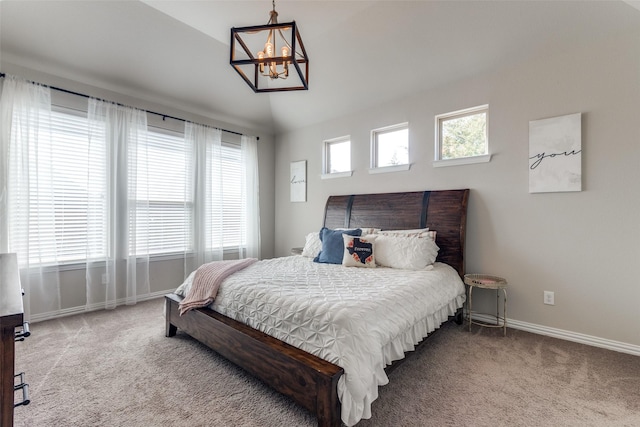 bedroom with lofted ceiling, carpet floors, multiple windows, and baseboards