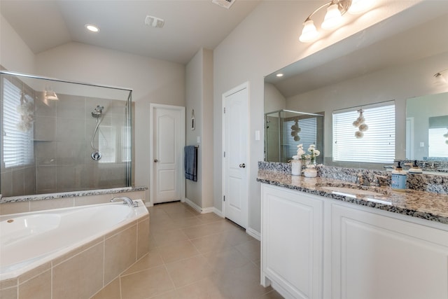 full bath featuring tile patterned flooring, vanity, vaulted ceiling, a bath, and a stall shower