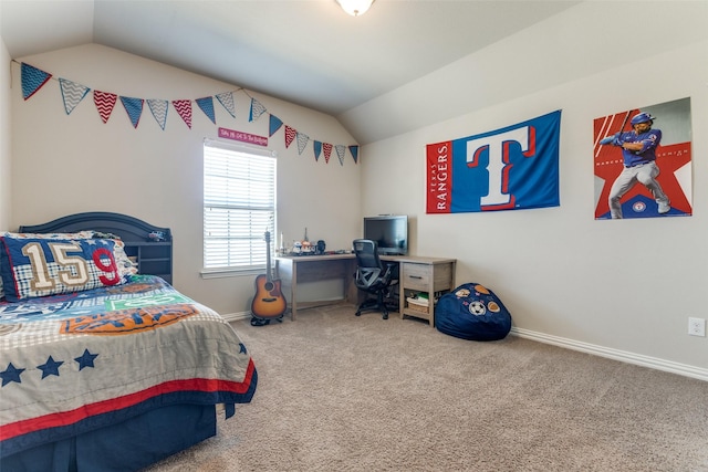 carpeted bedroom with vaulted ceiling and baseboards