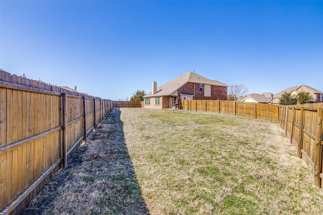 view of yard with a fenced backyard