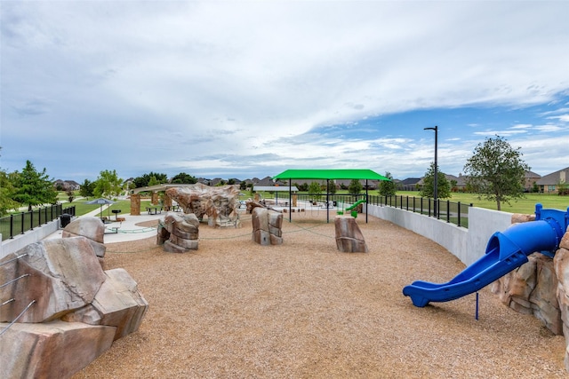 communal playground featuring fence