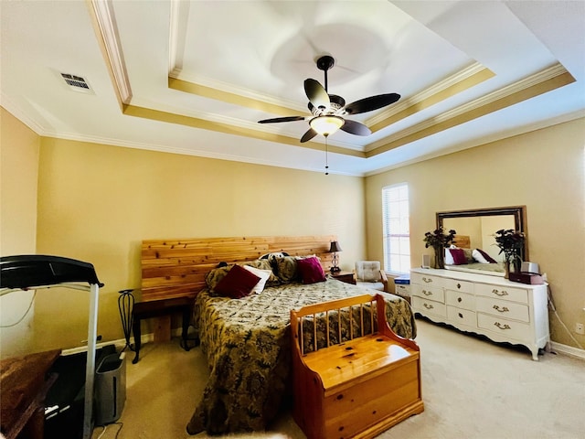 bedroom featuring ornamental molding, a raised ceiling, a ceiling fan, and light colored carpet