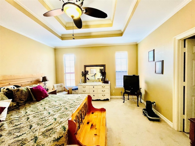 bedroom featuring carpet, multiple windows, ornamental molding, and a raised ceiling