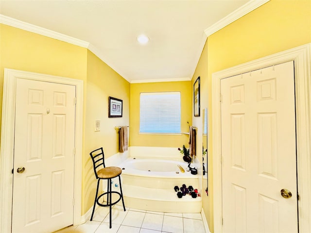 full bathroom featuring ornamental molding, a garden tub, baseboards, and tile patterned floors