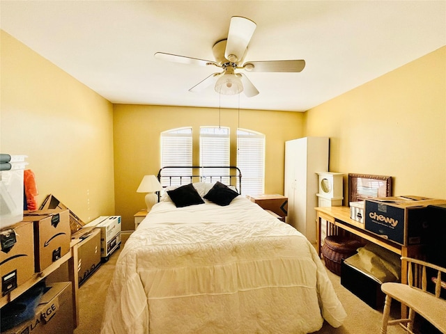 bedroom with ceiling fan and carpet floors