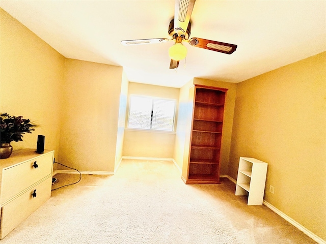 carpeted bedroom featuring a ceiling fan and baseboards