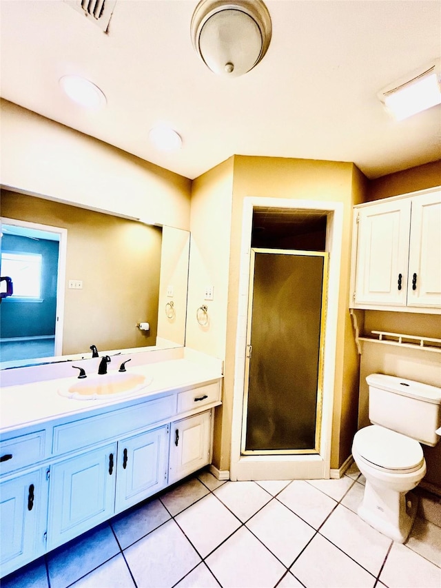 full bathroom with a stall shower, tile patterned flooring, vanity, and toilet