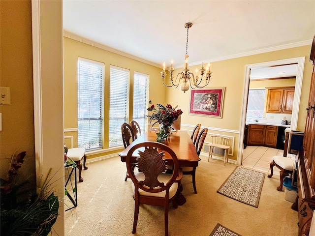 dining space featuring light carpet, ornamental molding, and an inviting chandelier