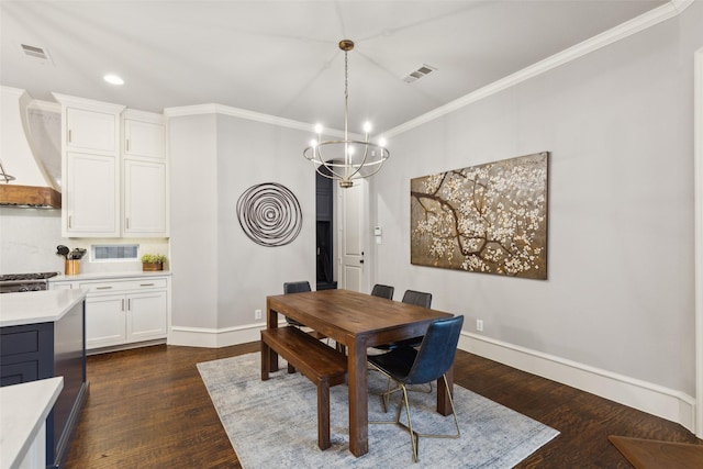 dining area featuring a chandelier, dark wood-type flooring, visible vents, baseboards, and crown molding