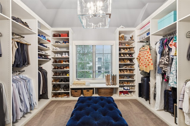 spacious closet with a chandelier, carpet, and radiator heating unit