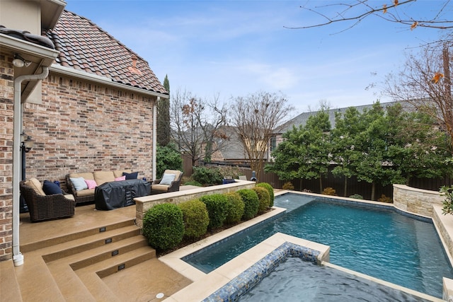 view of swimming pool featuring a hot tub, a fenced backyard, a fenced in pool, and a patio